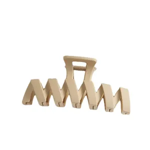 Beige geometric plastic hair claw clip, large retro shark clip for thick hair daily styling.