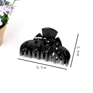 Black plastic hair claw clip, minimalist geometric hollow design, elegant women hair accessories.