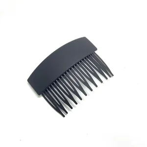 Matte black hair insert comb closeup, elegant french twist side comb for styling bangs and updos.