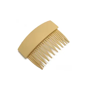 Detailed close-up of light yellow plastic hair insert comb for daily styling and updos.