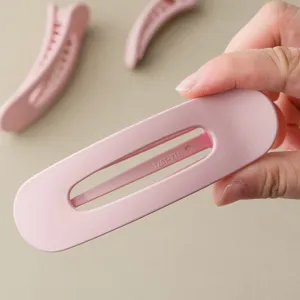 Minimalist pink hair clip, large oval cutout hair claw for cute daily use and hair accessories.