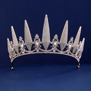 Gold rhinestone crown detail, sparkling crystals on metal tiara, elegant bridal hair accessory.