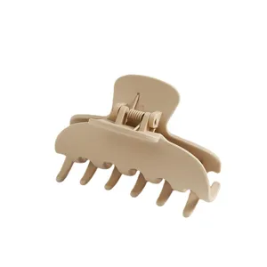 Elegant beige hair claw clip, large size matte finish hair styling accessory for women.