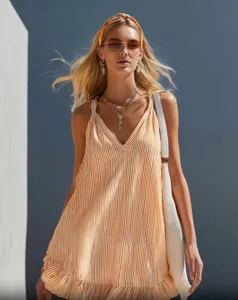 Detail shot of the stylish summer striped sleeveless v-neck ruffle mini dress, perfect resort wear.