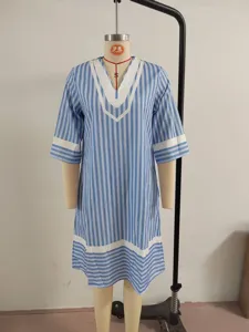 Blue and white striped V-neck beach dress, casual loose short sleeve resort wear.