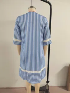 Detail view of blue and white striped short sleeve dress back design with contrast cuffs.