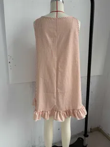 Detailed view of the sleeveless striped dress featuring a charming ruffled hem design.