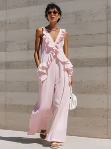 Detailed view of the pink sleeveless linen jumpsuit featuring romantic ruffles and deep V-neck.