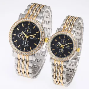 Luxury couple quartz watch set with crystal bezel, stainless steel strap, and chronograph dial.