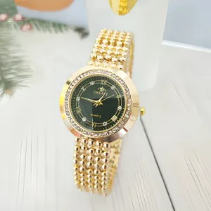 Gold women quartz watch with rhinestones black dial roman numerals stylish wristwatch