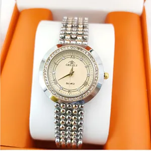 Elegant women's quartz wristwatch with rhinestone bezel, Roman numerals, and metal beaded strap.