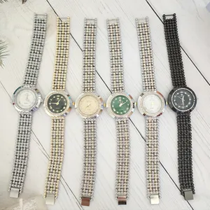 Fashion rhinestone quartz watch for women with multi-strand beaded metal strap and round dial.