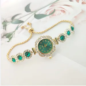 Detailed shot of a luxury women quartz watch with green dial, rhinestone bezel and adjustable pull bracelet.