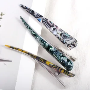 Long acrylic alligator hair clips set with abstract marble pattern, elegant metal hair styling tools