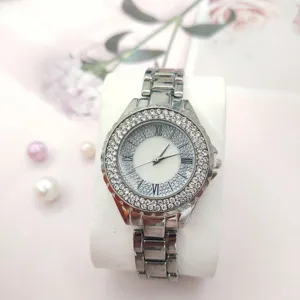 Elegante dames quartz horloge met sprankelende strass-steentjes, zilveren stalen band en Romeinse c.