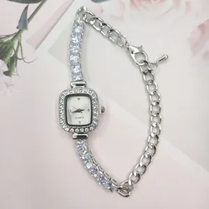 Detail view of the elegant square crystal quartz women's watch featuring a stylish silver bracelet.