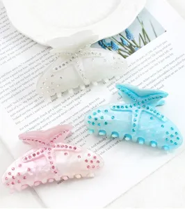 Fermaglio per capelli in acrilico a stella marina con strass brillanti, ideale per acconciature.