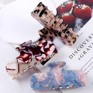 Elegante molletta per capelli in acetato per donne, accessorio con design effetto marmo.