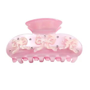 Molla per capelli rosa in acrilico con fiocchi carini e strass luminosi eleganti.