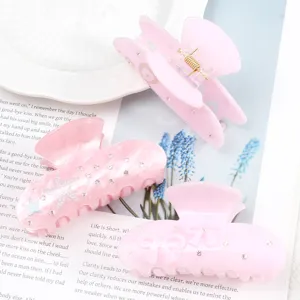 Mollette per capelli rosa in acrilico con strass, stelle marine e fiocchi per stile quotidiano.