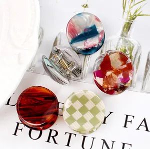 Mini mollette per capelli rotonde, accessori in acetato colorato per lo styling quotidiano.