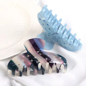 Elegante molletta per capelli in acetato con strass, perfetta per acconciature quotidiane.