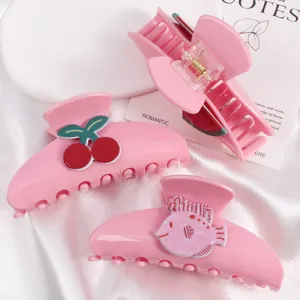 Set di mollette per capelli rosa con simpatici motivi di ciliegia, anguria e pesce.
