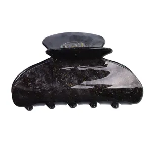Piccola molletta per capelli in acrilico con design glitter stellato per uso quotidiano.