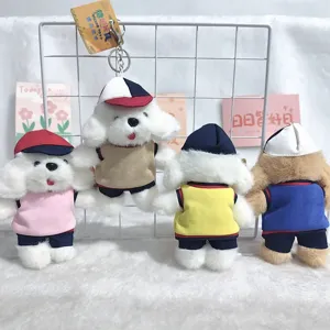 Cute puppy plush toy keychain detail, dressed in uniform cap and vest, bag pendant.