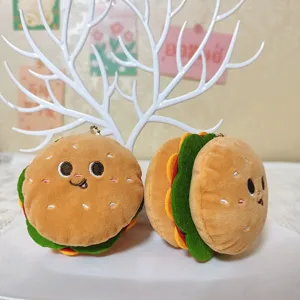 Cute plush burger keychain detail showing soft fabric, embroidered face and hamburger layers.