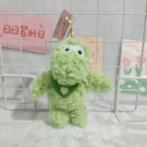 Cute green fluffy dinosaur plush keychain with heart scarf backpack pendant accessory.