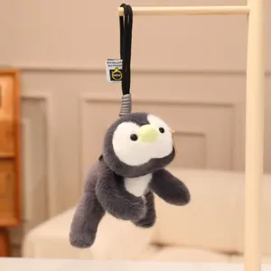Detailed view of the cute penguin plush toy hanging charm, soft stuffed animal for bags or keys.