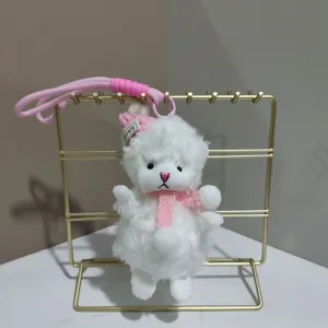 Joli pendentif en peluche mouton blanc avec écharpe et bonnet rose pour sac et cadeau.