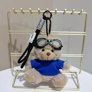 Cute plush bear keychain with aviation goggles and blue sweater doll pendant bag charm