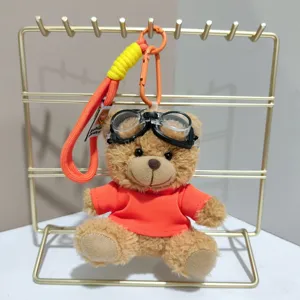 Cute flying bear plush toy doll keychain with pilot goggles and orange t-shirt backpack pendant.