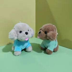Cute plush toy poodle puppy keychain bag charm detail showing soft fabric and cute clothes.
