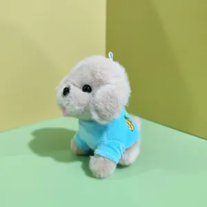 Cute plush puppy toy pendant detail shot, showing soft texture and blue shirt with pineapple.