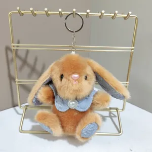 Schattige pluche konijnen sleutelhanger met blauwe cape, zachte accessoire voor tas.