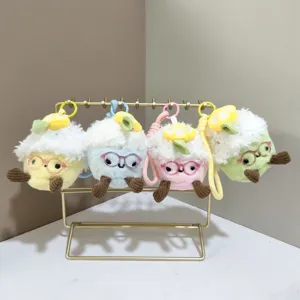 Detailed shot of cute plush ice cream keychains with glasses and lemon slice decor.