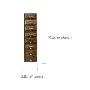 Vintage mini apothecary cabinet bookmark detail showing retro wooden drawer design.