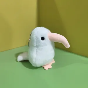 Cute white kiwi bird plush keychain, soft fluffy fabric toy pendant for bag charm decoration.