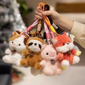 Cute animal plush keychain detail shot, fluffy toy pendant with colorful lanyard for bags and keys.