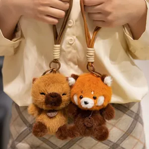 Cute plush red panda and capybara keychain pendant, soft bag decoration accessory.
