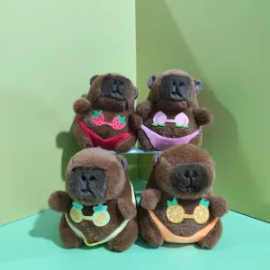 Cute capybara plush toy keychain pendant detail showcasing lovely fruit bikini design.
