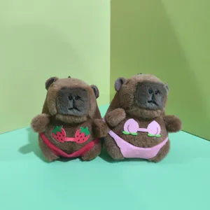 Cute capybara plush pendant details, soft stuffed doll in funny bikini, close-up view