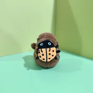 Cute capybara plush toy with ladybug backpack keychain, soft stuffed animal bag accessory.
