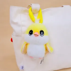 Cute yellow titmouse plush toy keychain hanging on bag, soft cute doll pendant gift.