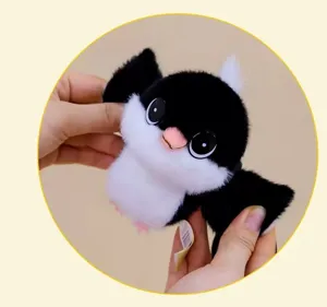 Cute black and white long-tailed tit plush toy pendant, soft and fluffy bird doll gift.