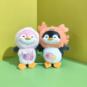Cute plush penguin pendant toy with silicone face and lovely fish decor for bags and keys.