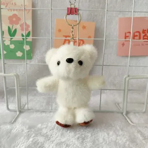 White plush bear keychain cute fluffy animal toy doll bag charm pendant detail view.